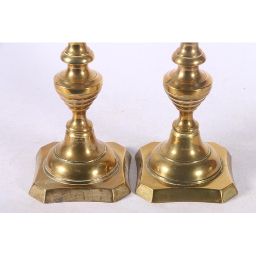 92 - Pair of brass candlesticks.