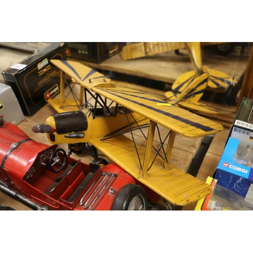 236 - Large scale metal biplane, a similar saloon car, and three locomotive models.