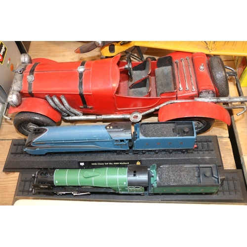 236 - Large scale metal biplane, a similar saloon car, and three locomotive models.