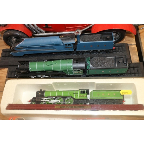 236 - Large scale metal biplane, a similar saloon car, and three locomotive models.