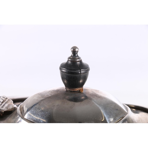 18 - George V hallmarked silver three-piece tea set, the faceted shaped teapot with ebony finial and angu... 