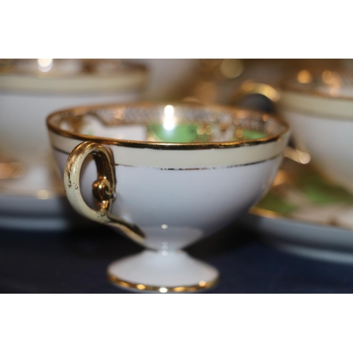 91 - Six Noritake floral and gilt decorated cups and saucers, etc.