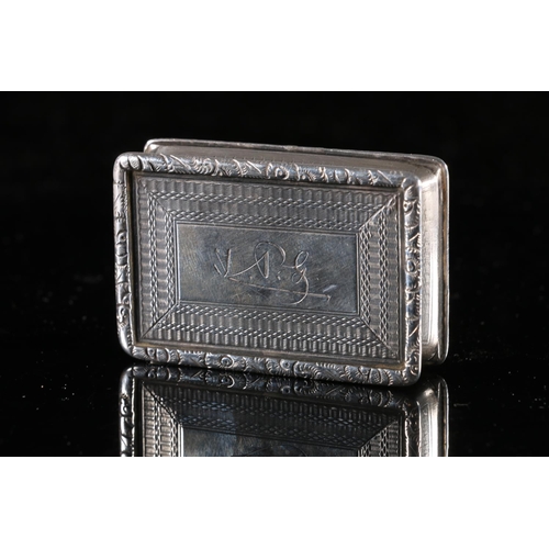 100 - Edwardian antique parcel gilt silver snuff box of rectangular form with raised floral border, concav... 