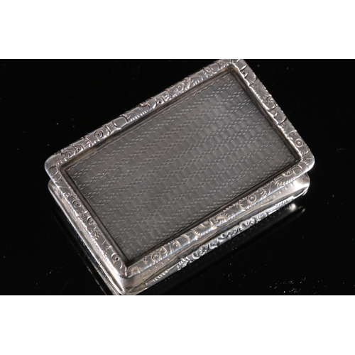 100 - Edwardian antique parcel gilt silver snuff box of rectangular form with raised floral border, concav... 