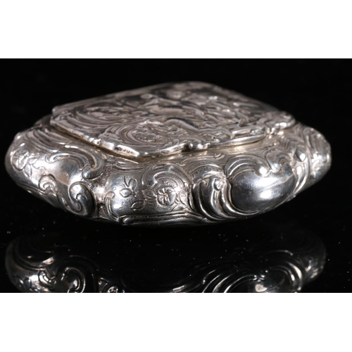 102 - Continental silver table tobacco box of cartouche form, the hinged cover decorated in relief with cl... 