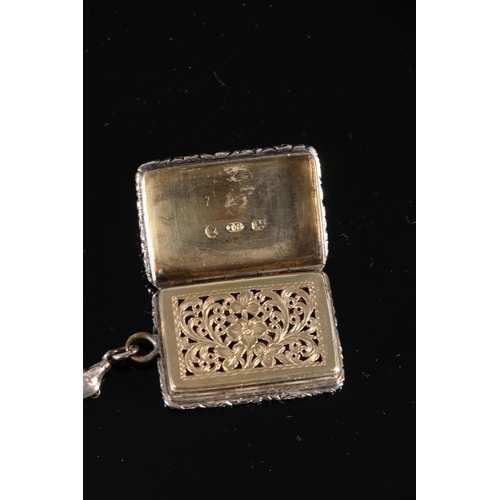 110 - Victorian antique parcel gilt silver vinaigrette of rectangular form with relief floral decorated bo... 