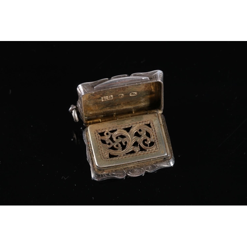 120 - Victorian antique silver vinaigrette of rectangular form with serpentine edge, the body incised with... 