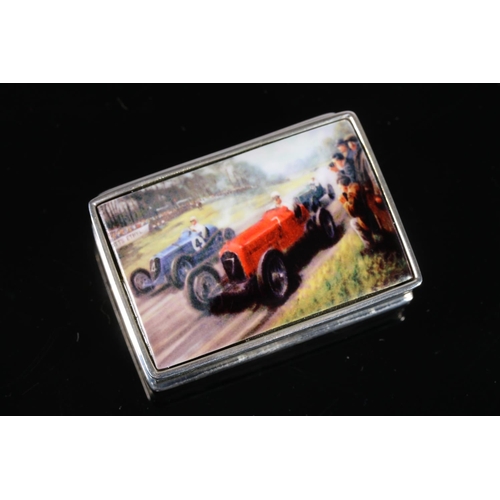 121 - Continental modern silver pill or snuff box of rectangular form, the cushion shaped ceramic top deco... 