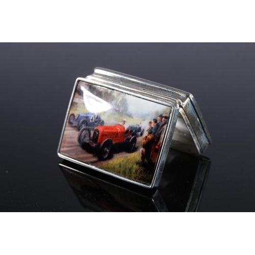 121 - Continental modern silver pill or snuff box of rectangular form, the cushion shaped ceramic top deco... 