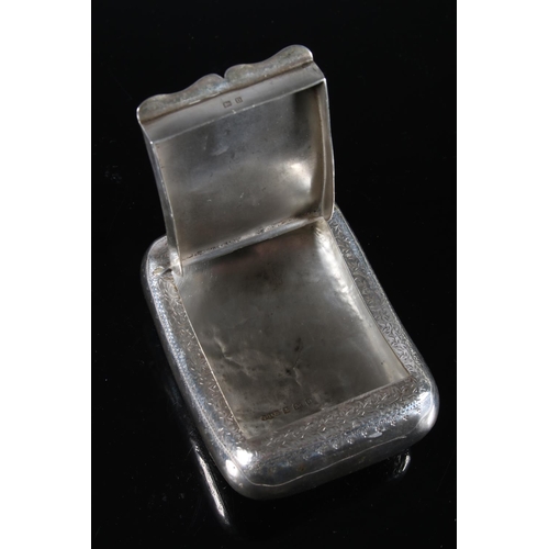 73 - Antique silver pocket tobacco box of scroll shape to fit comfortably around a leg, the body incised ... 