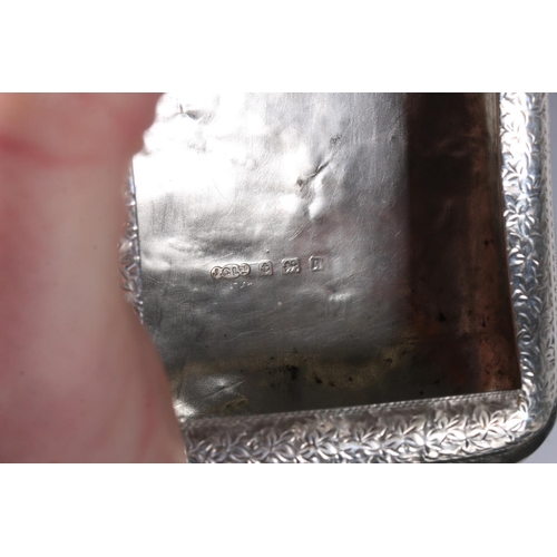 73 - Antique silver pocket tobacco box of scroll shape to fit comfortably around a leg, the body incised ... 