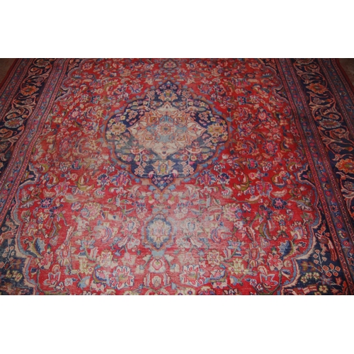 412 - Persian Kashan hand-knotted carpet with large floral medallion to the centre, surrounded by foliate ... 