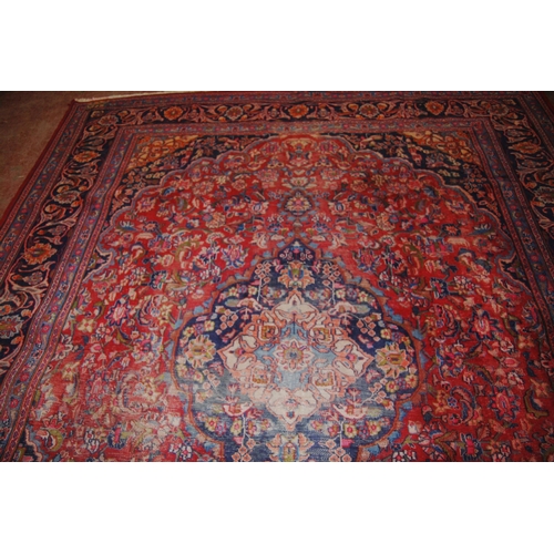 412 - Persian Kashan hand-knotted carpet with large floral medallion to the centre, surrounded by foliate ... 