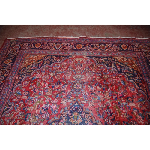 412 - Persian Kashan hand-knotted carpet with large floral medallion to the centre, surrounded by foliate ... 