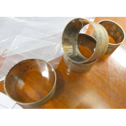 485 - Four silver napkin rings.