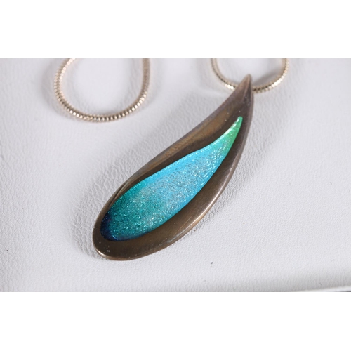 501 - Malcolm Gray for Ortak, a silver and enamel teardrop shaped pendant and pair of matching earrings in... 