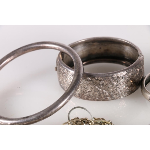 505 - Victorian silver half engraved bangle and a hollow silver bangle, 40g, an 800 grade silver bangle 10... 