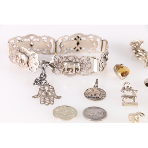 506 - Indian white metal bracelet, the five panels decorated with elephants, cutlasses and hamsa hand, a w... 