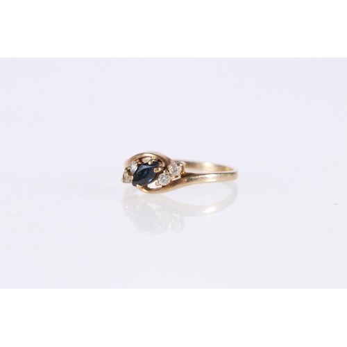 516 - 9ct gold crossover ring set with marquise cut dark sapphire between flanking white stones, size M/N,... 