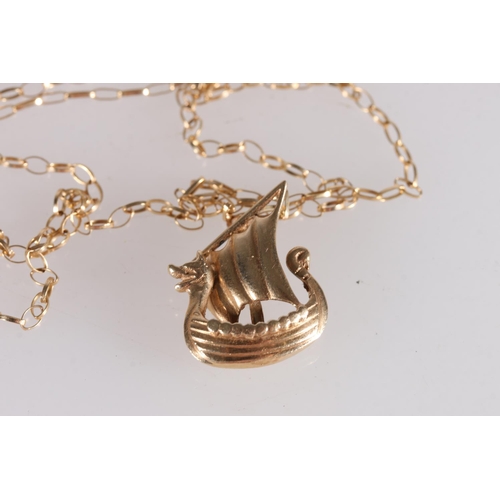 525 - Yellow metal pendant in the form of a Viking longship, 3.0g, together with a 9ct gold chain, 1.3g