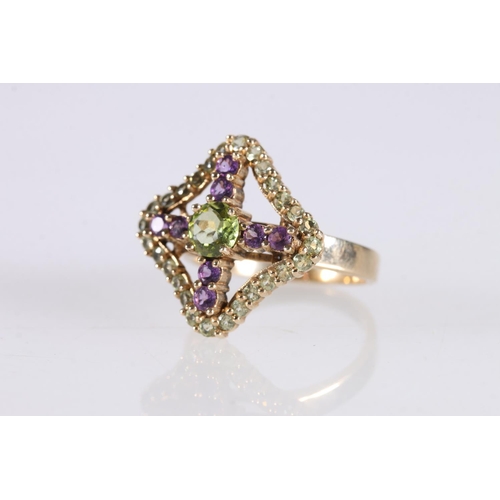 537 - Peridot and amethyst cluster dress ring, the central peridot and cross form amethysts within peridot... 