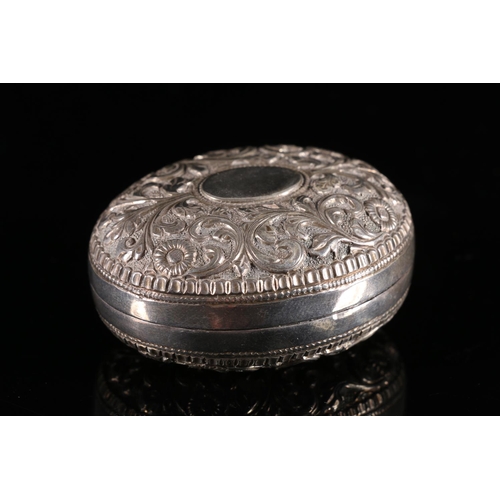 563 - Indian white metal two piece pill box embossed with flowers and scrolls, W6cm, 41g