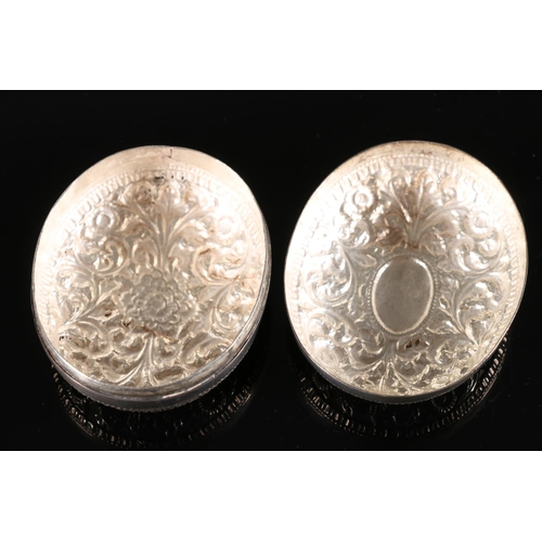 563 - Indian white metal two piece pill box embossed with flowers and scrolls, W6cm, 41g