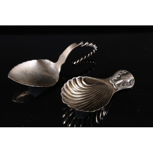 577 - Silver caddy spoon of shell form with thistle finial, makers JR, Birmingham 1962 together with a ben... 