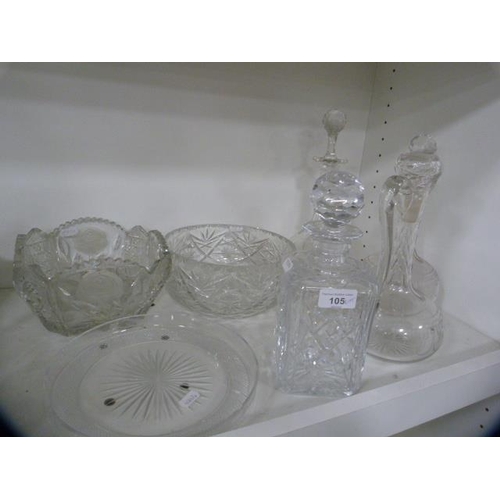 105 - Crystal and cut glass to include bowls, decanters and a star-cut ice plate.