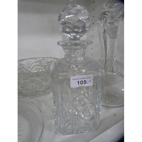 105 - Crystal and cut glass to include bowls, decanters and a star-cut ice plate.