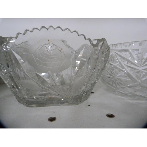 105 - Crystal and cut glass to include bowls, decanters and a star-cut ice plate.