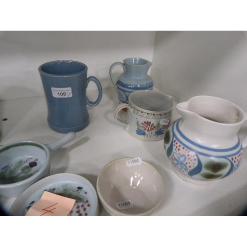 109 - Buchan stoneware to include mugs, jugs, dishes and tankards (one shelf).