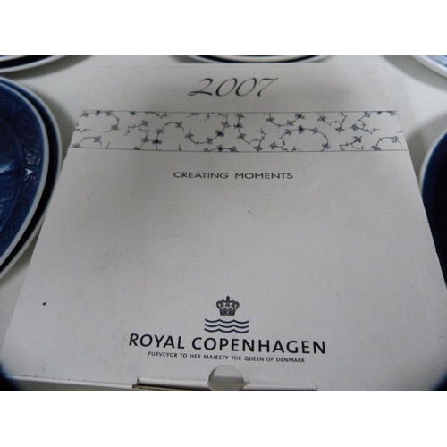 119 - Collection of 1970s and later Royal Copenhagen Christmas plates (one shelf).