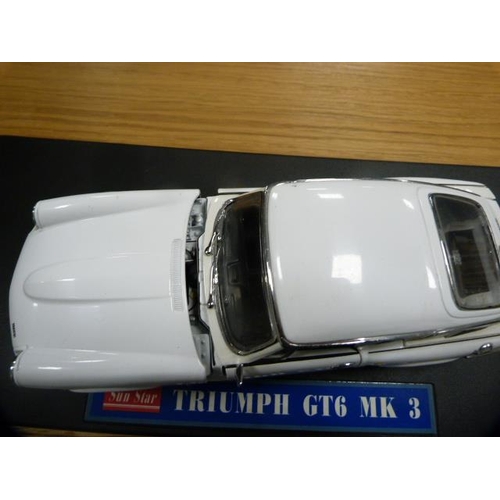 130 - Box of model cars, mainly Chinese models, to include Aston Martin Vanquish, Triumph GT6, Clarion 206... 