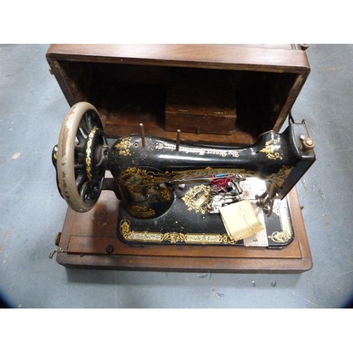 142 - Portable singer sewing machine in fitted carry case.