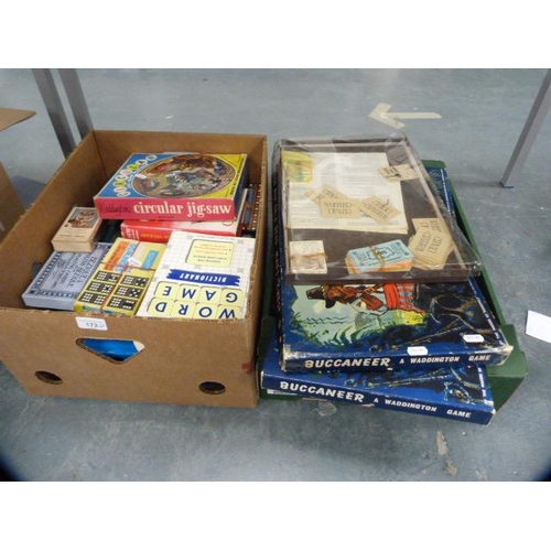 172 - Two cartons containing assorted games to include playing cards, Scrabble, Waddingtons Buccaneer, Mon... 