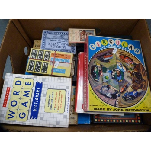 172 - Two cartons containing assorted games to include playing cards, Scrabble, Waddingtons Buccaneer, Mon... 