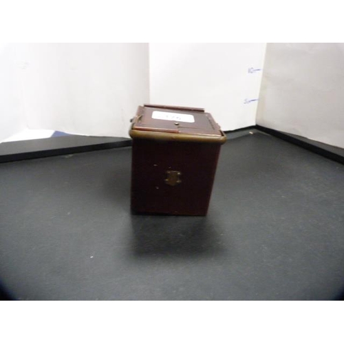 176 - Desk or travel clock in a stained wood case, c. early 20th century.