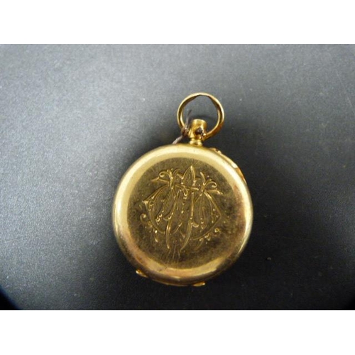 215 - Victorian 18ct gold fob watch (a/f), monogrammed to reverse, 28g gross.