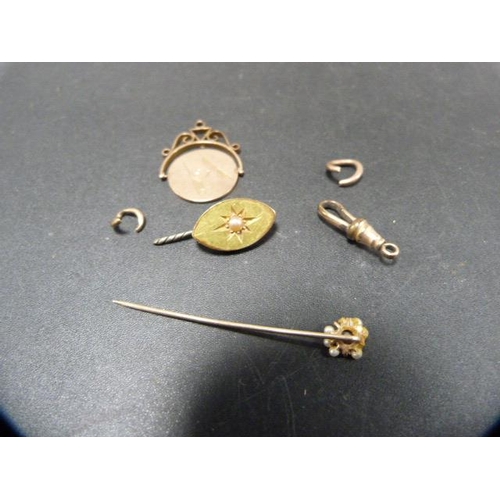 220 - Swivel fob, marked 9ct to the mount, 5g gross, also a stick pin and another pin.