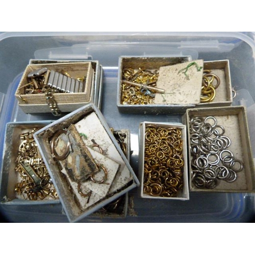 226 - Two tubs containing a quantity of rolled gold jewellery accessories, links, T-bars, pins, catches an... 