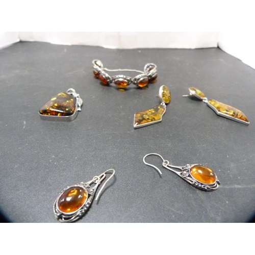 242 - Silver bracelet with matching earrings set with faux amber stones, and a similar pair of silver-moun... 