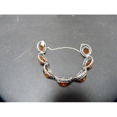 242 - Silver bracelet with matching earrings set with faux amber stones, and a similar pair of silver-moun... 