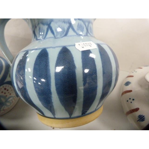 256 - Five assorted Buchan jugs and another jug.  (6)