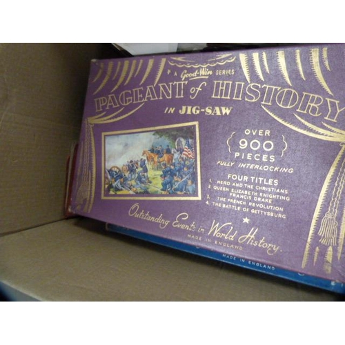 265 - Carton containing a stamp album, art magazines, jigsaws, cutlery case etc.