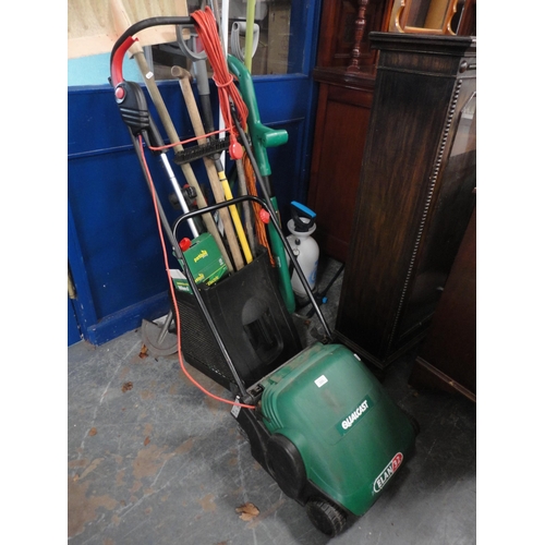 295 - Group of garden tools to include a Qualcast lawnmower, spade, strimmer, sprayer etc.