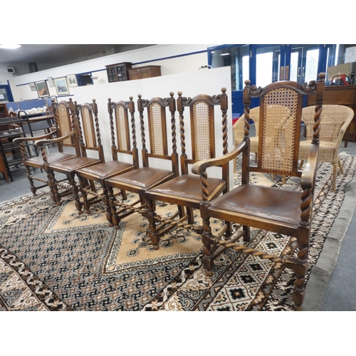 299 - Set of six oak dining chairs with bergère back rests, including a pair of carvers.  (6)