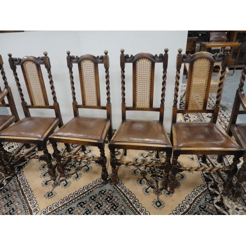 299 - Set of six oak dining chairs with bergère back rests, including a pair of carvers.  (6)