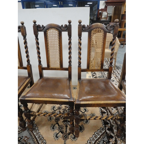 299 - Set of six oak dining chairs with bergère back rests, including a pair of carvers.  (6)