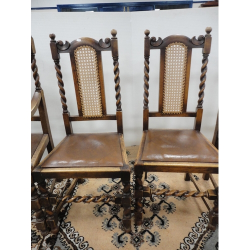 299 - Set of six oak dining chairs with bergère back rests, including a pair of carvers.  (6)